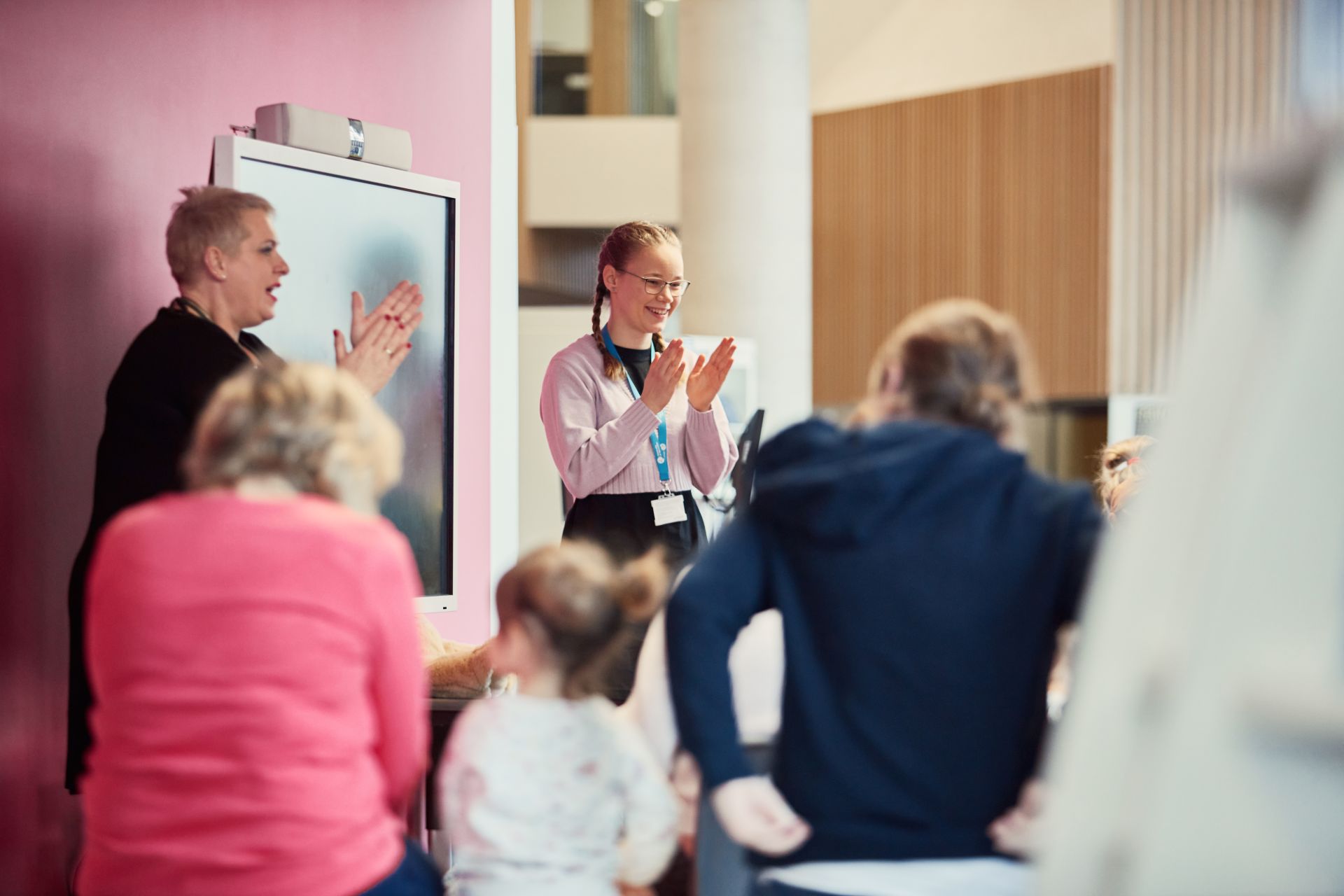 Two people teaching a group
