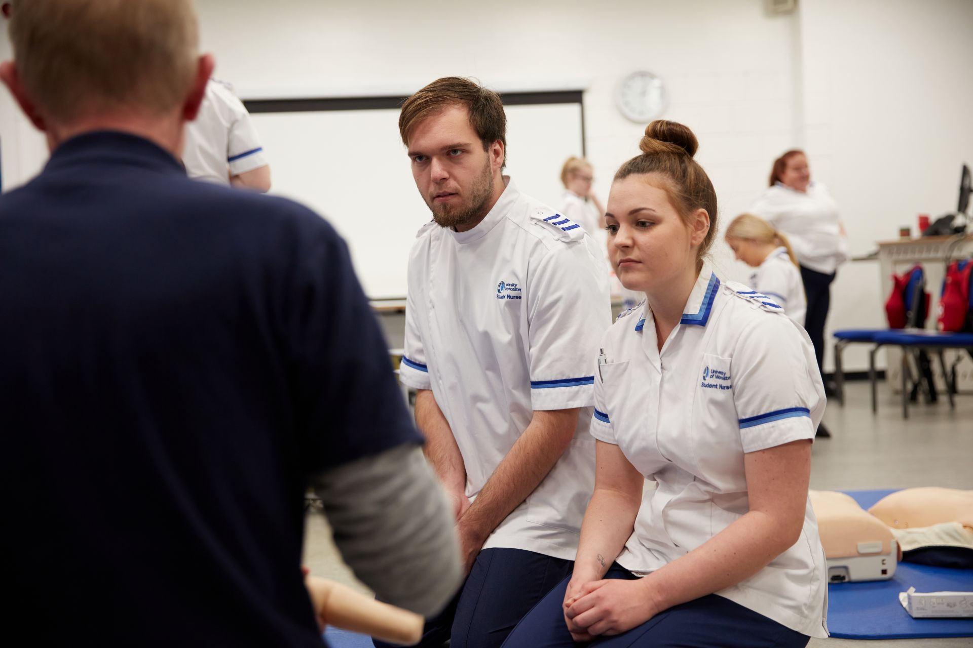Two nurses being taught